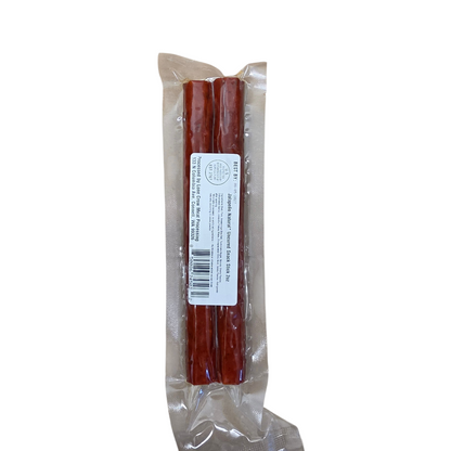 shopnathans.com Lone Crow Jalapeno snack stick in clear vacuum-sealed packaging on a cardboard background