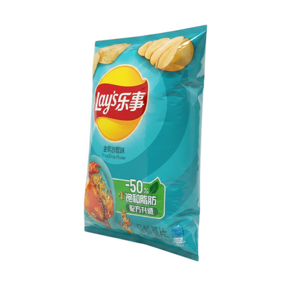 shopnathans.com Lay's Fried Crab flavor potato chips in a 70g blue bag with a savory crab graphic on a wooden table.