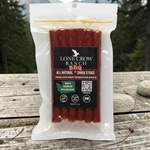 shopnathans.com Lone Crow Ranch BBQ all-natural meat sticks in a 6oz resealable pouch on a rustic outdoor table