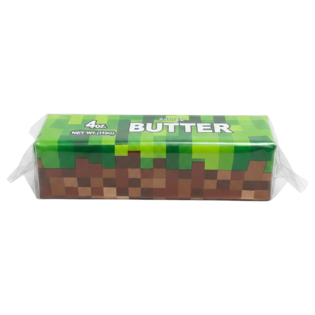 shopnathans.com Minecraft themed 4oz squishy butter toy with green grass and brown dirt block pixel design