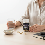 shopnathans.com Nature's Alks liposomal capsules bottle on a desk with a glass of water and loose supplements