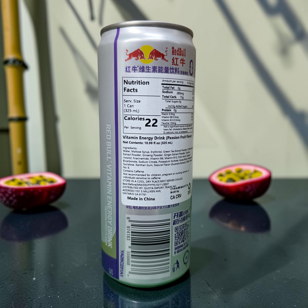shopnathans.com Red Bull passion fruit energy drink can showing nutrition facts label with sliced fruit background