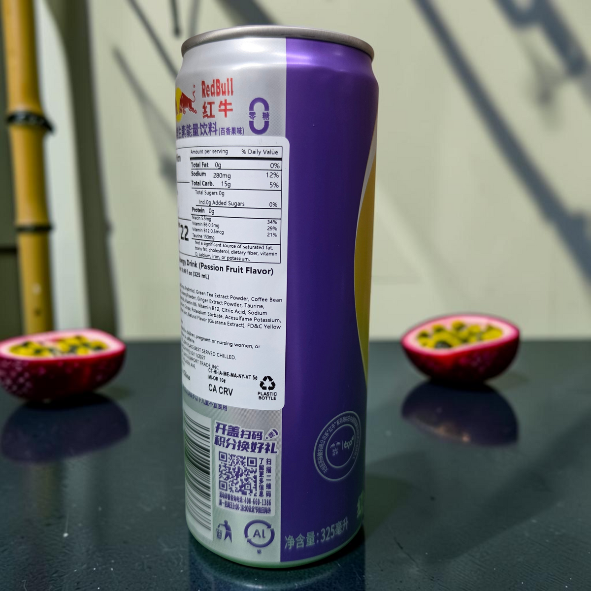 shopnathans.com Red Bull imported passion fruit energy drink 300ml can with exotic fruit halves on a dark surface
