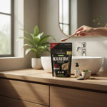 shopnathans.com Pure Infinity Botanicals Red Maeng Da Kratom powder in an 8oz resealable pouch on a wooden bathroom vanity