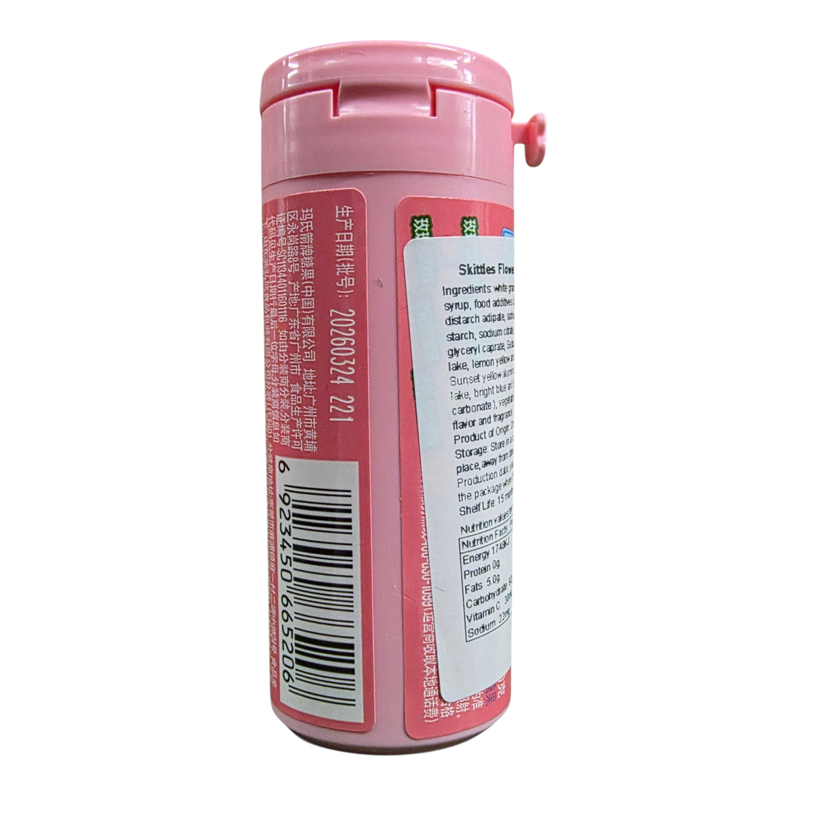 shopnathans.com Skittles Bottle Flowery Fruity Flavor 30g with a fresh strawberry on a white surface