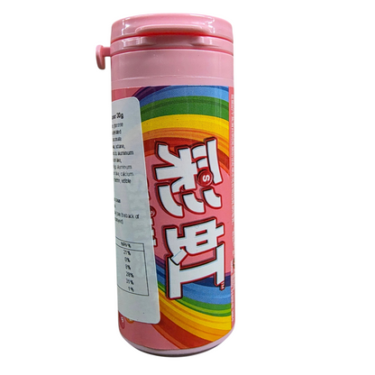 shopnathans.com Skittles Flowery Fruity flavor candy bottle with pink lid and rainbow label on a marble surface.