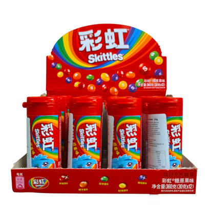 shopnathans.com Skittles fruit flavor candy bottles in a red display box featuring a vibrant rainbow logo
