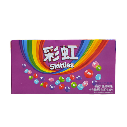 shopnathans.com Skittles Wild Berry chewy candy box featuring a vibrant rainbow design and purple background