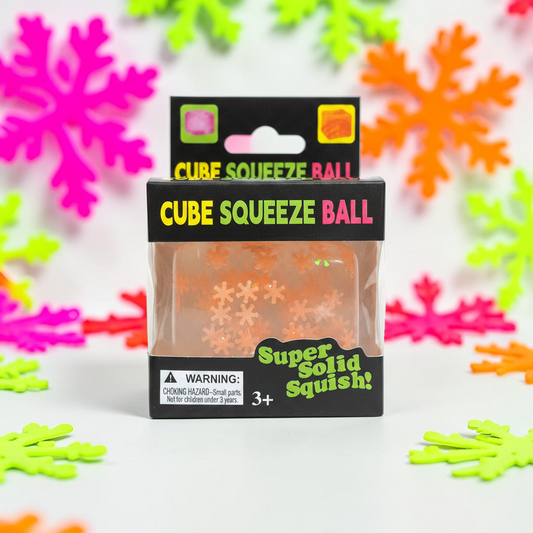 shopnathans.com Squishy Snowflake Cube sensory toy in orange packaging with festive snowflake decorations