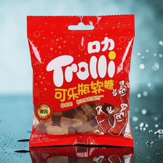 shopnathans.com Trolli cola-flavored gummy candies in a red 60g bag with bottle-shaped treats